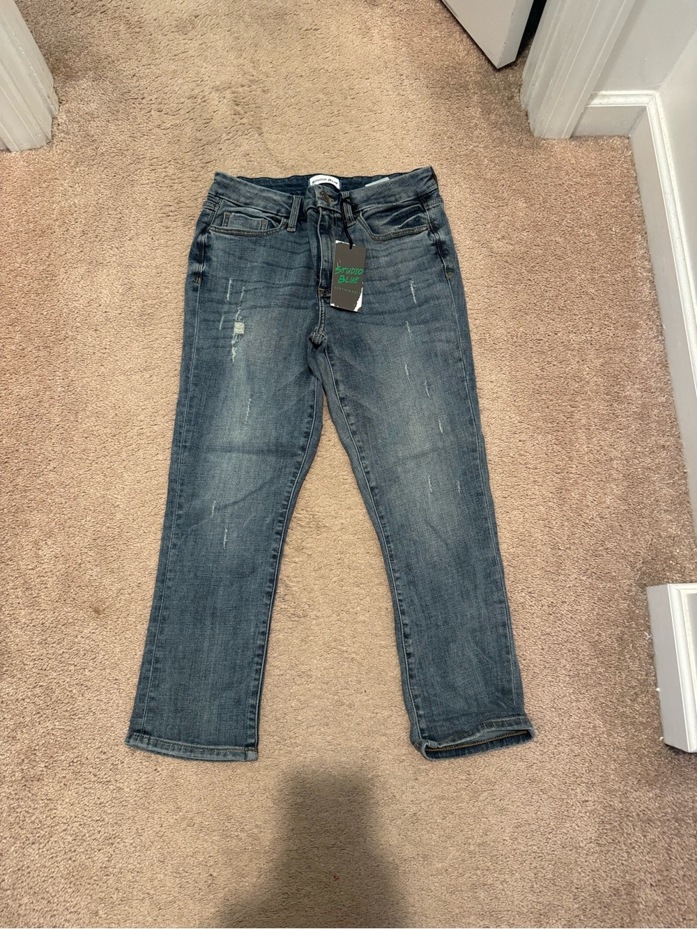 Studio Blue Jeans in Faded Blue with Distressed Details